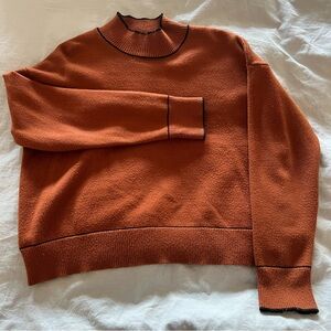 Rust Orange Sweater with Black Trim